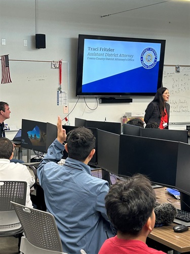 Assistant District Attorney Traci Fritzler visits students in class.