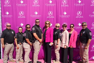 District Attorney Smittcamp and members from the District Attorney Bureau of Investigations proudly wear pink patches in a show of solidarity and support for breast cancer awareness.