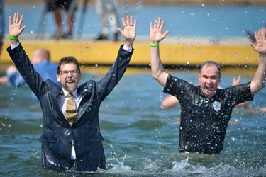 Assistant District Attorney Steve Wright (left) and Investigations Commander Colin Spence (right) take the plunge for the Special Olympics, diving into icy waters with enthusiasm and a shared commitment to supporting these extraordinary athletes.